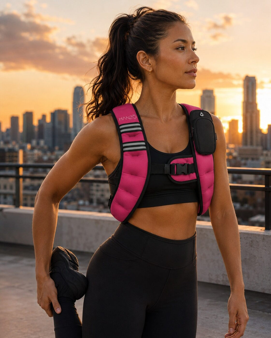 A woman wearing the HANZO pink running weight vest